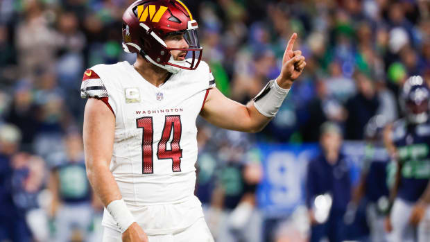 Nov 12, 2023; Seattle, Washington, USA; Washington Commanders quarterback Sam Howell (14) signals to the sideline during the fourth quarter against the Seattle Seahawks at Lumen Field.